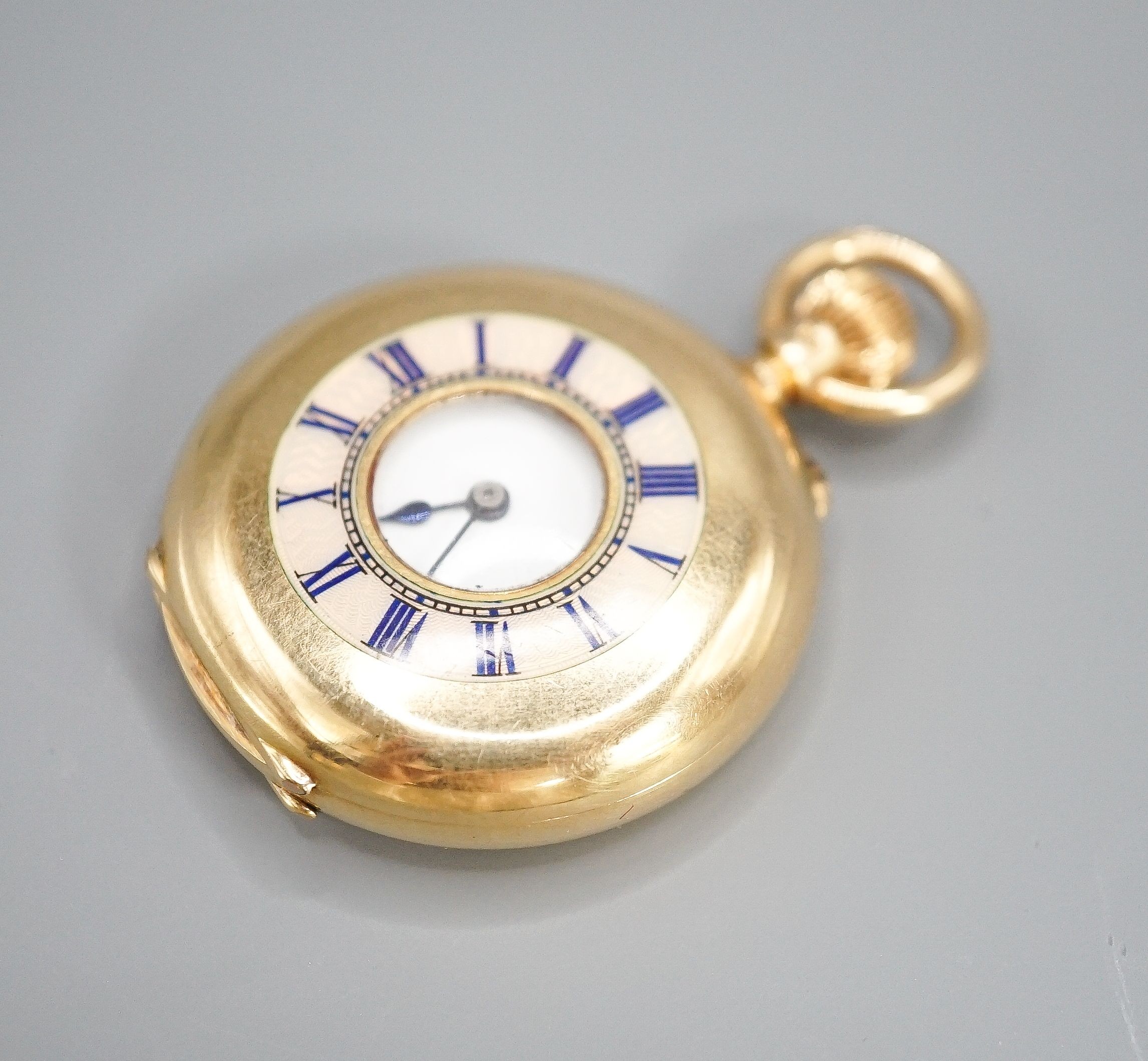 An Edwardian 18ct gold and guilloche enamel half hunter fob pocket watch, case diameter 35mm, gross 47.3 grams.